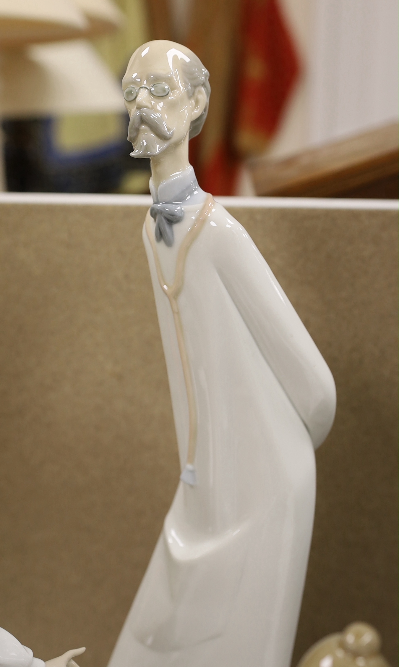 A group of four LLadro figures, tallest 41cm